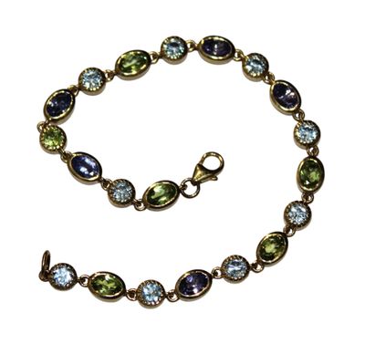 BRACELET en argent doré 925/1000 serti de tanzanites et topa…