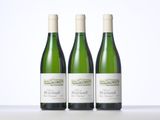 three bottles of wine sitting on top of a table next to each other