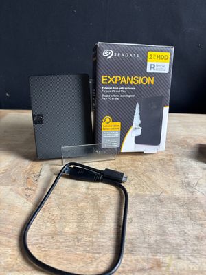 the external hard drive is sitting on a table next to an external hard drive