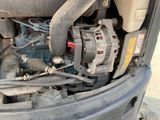 a close up of a car ' s engine and its parts