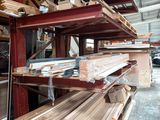 many pieces of wood stacked on the shelves in the warehouse