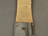 a close up of a small knife on a piece of cloth