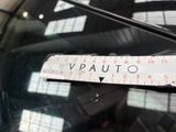 a close up of a sticker on the windshield of a car