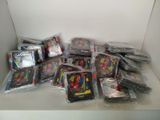 many different types of toys in bags on a shelf