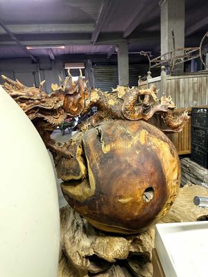 an image of a sculpture of a fish made out of wood