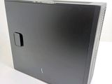 a computer that is sitting on a white surface