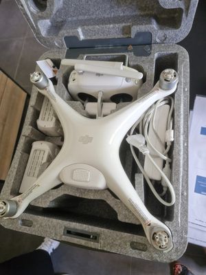 a white drone sitting inside of a case on the floor
