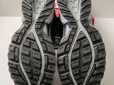 the soles of a pair of running shoes on a white surface