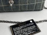 the chain is attached to a purse with a tag attached to it