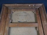 a picture of an old wooden frame with a sign on it