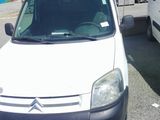 a white van parked next to a white van in a parking lot