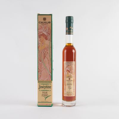 a bottle of whisky with a box on a white background