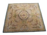 an image of a beige and blue rug with a floral design on it