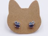 pair of blue and white crystal stud earrings on a cardboard board