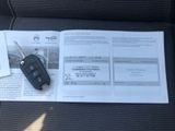 a car key sitting on top of a book on the seat
