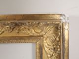 a picture of a mirror with a gold frame on it