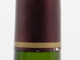 a bottle of wine that is sitting on a table