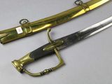 two different types of swords on display on a table