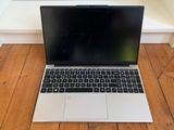 an apple macbook pro laptop is sitting on a wooden floor