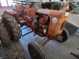 a tractor that is sitting in a garage