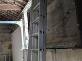 a ladder leaning against a wall in a room