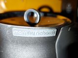 a close up of a black coffee maker on a counter