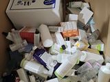 a cardboard box full of toilet paper and other items