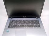 a laptop that is sitting on a white table