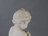 marble statue of a child praying with hands clasped