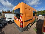 an orange van that is parked in a parking lot