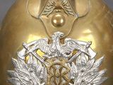 a gold helmet with a crest and a crown on it