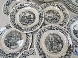 a lot of plates that are sitting on a table