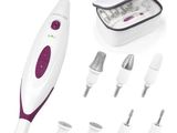 a close up of a white and purple electric device with several attachments