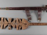 two different types of weapons displayed on the wall