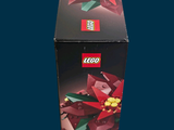 a box that has a lego poinsetti on it