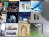 a lot of different album covers on the table