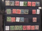 a lot of different stamps on a display case