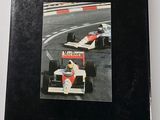 an image of a book with a picture of a racing car