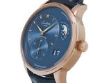 a close up of a wrist watch with a blue dial
