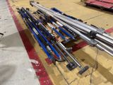 a pile of ski poles sitting on the ground in a parking lot