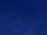 a blue book with writing on it and a clock on the cover
