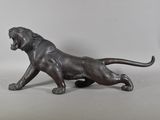 an image of a bronze statue of a lion on a white background