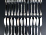a set of twelve silverplated flatware forks and spoons