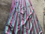 a close up of a skirt laying on the floor in a room