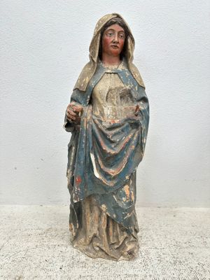statue of a woman holding a baby in her arms