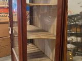 a display case with a mirror in the middle of it
