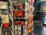 a display of greeting cards on a rack in a store