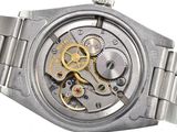 an image of a watch with a metal band and a silver watch face