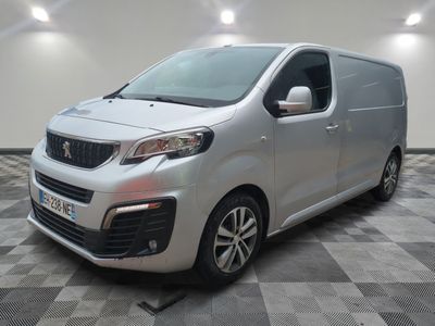 the silver van is parked on a checkered tile floor