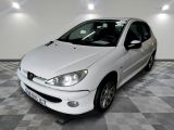 a picture of a white car parked in a garage